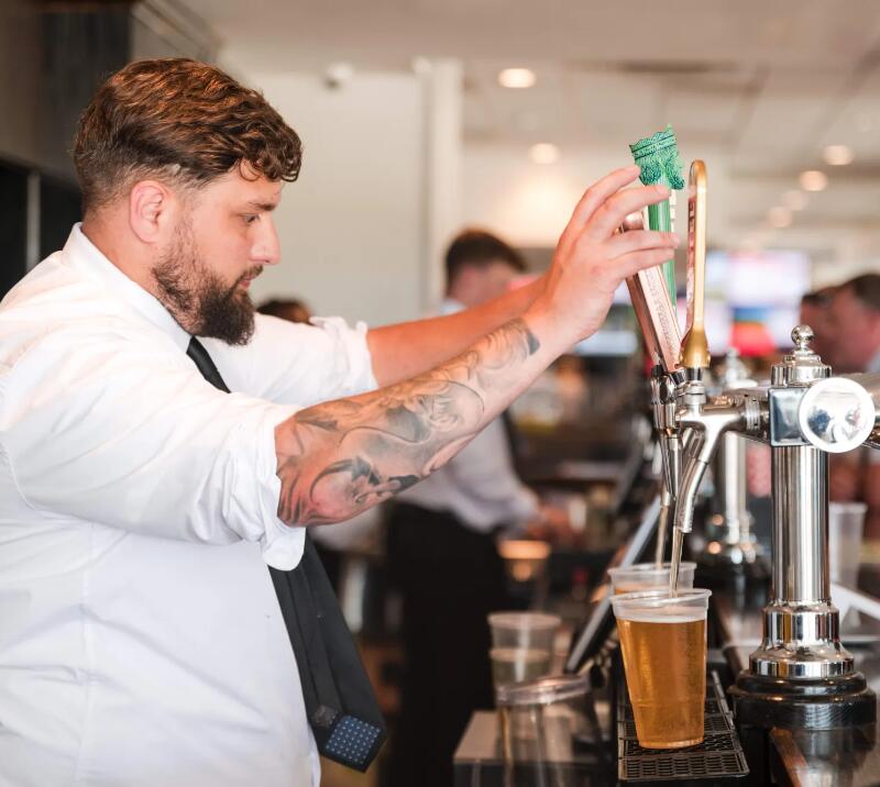 Server pouring drinks