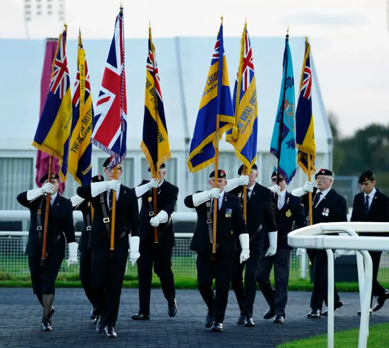 Group of soldiers carrying flags.