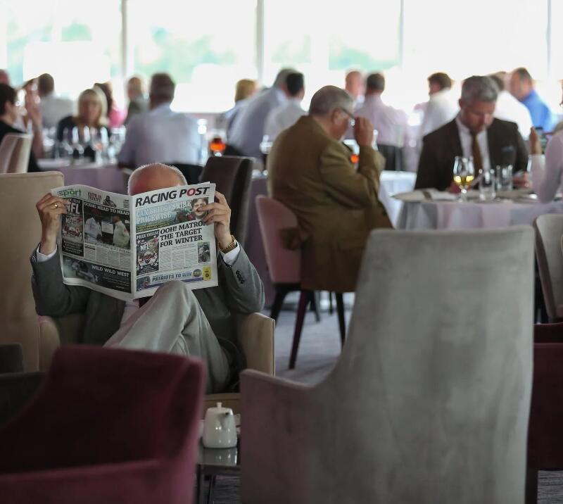 Racegoers sitting in the Lounge.