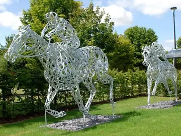 Horse racing sculptures made of metal