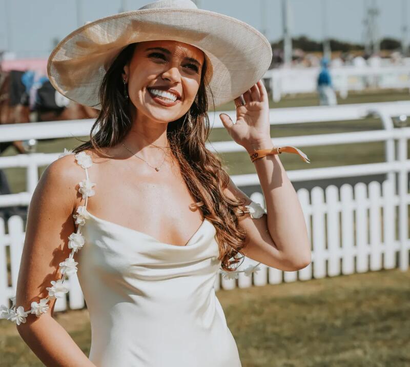 Dressed up lady smiling for a photo at Chelmsford Racecourse