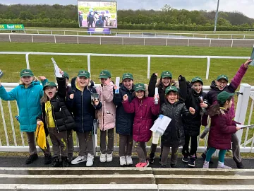 A group of children enjoying their visit to Chelmsford City Racecourse